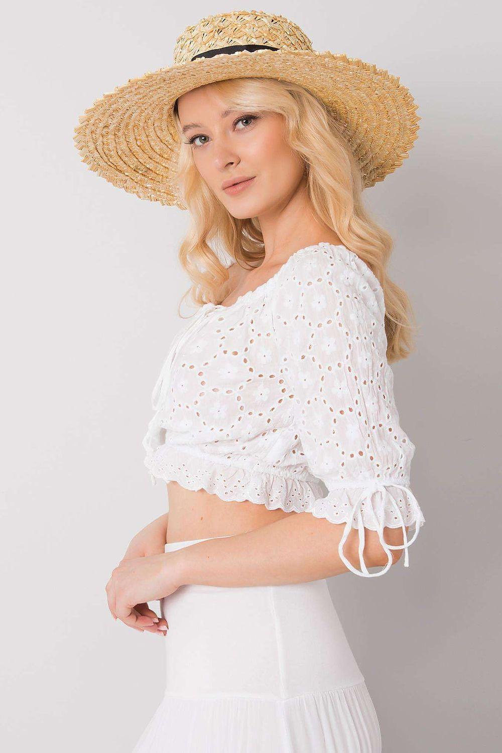 White off-shoulder blouse with gathered neckline, puff sleeves, and eyelet speckle pattern