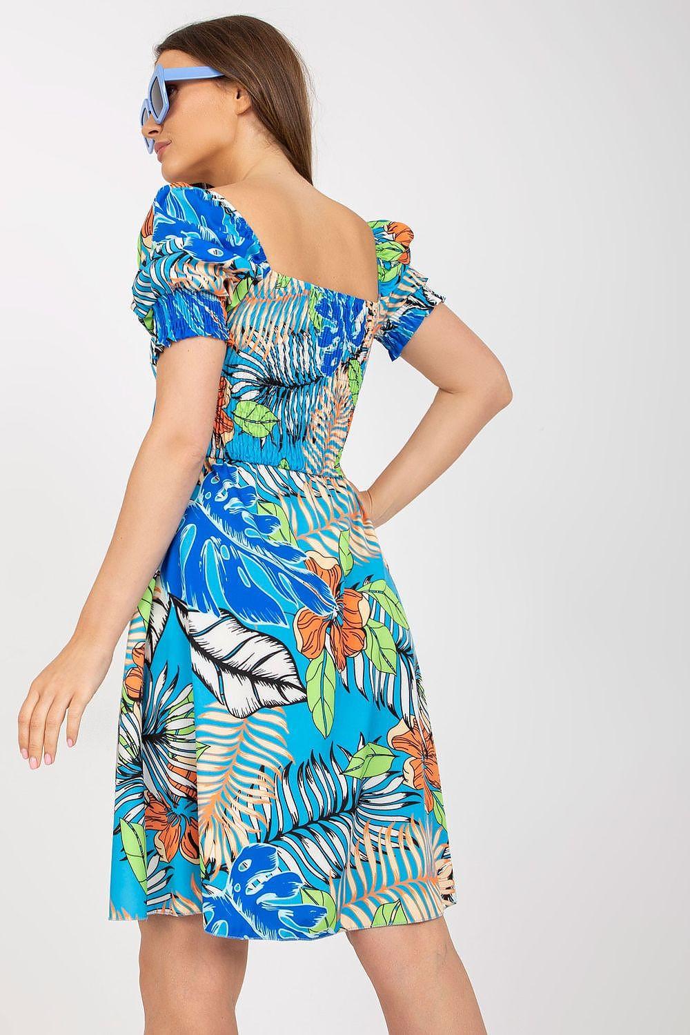 Blue tropical print day dress with puff sleeves, gathered waist, A-line skirt