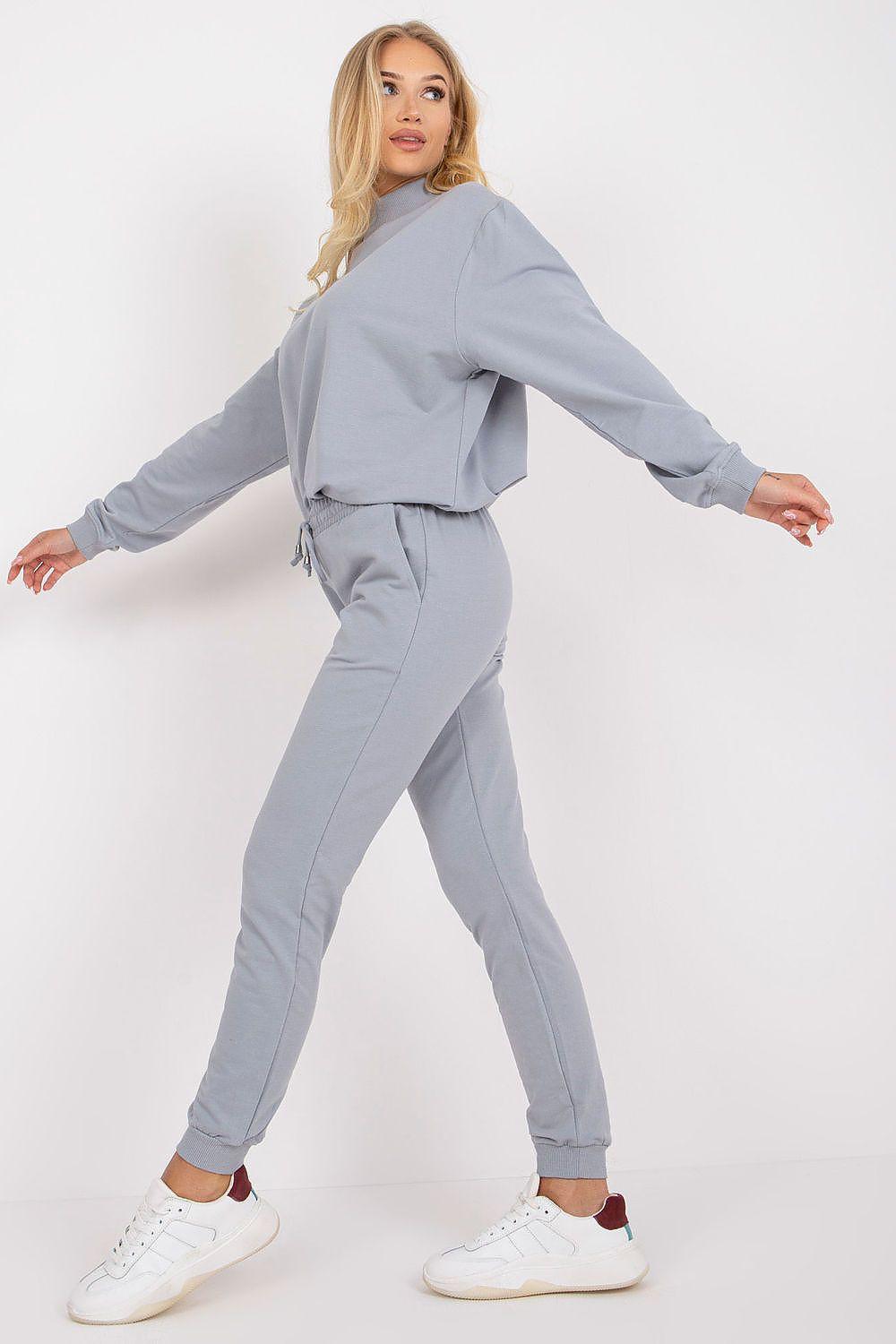 Grey tracksuit trousers with elastic drawstring waist and cuffed ankle, full view