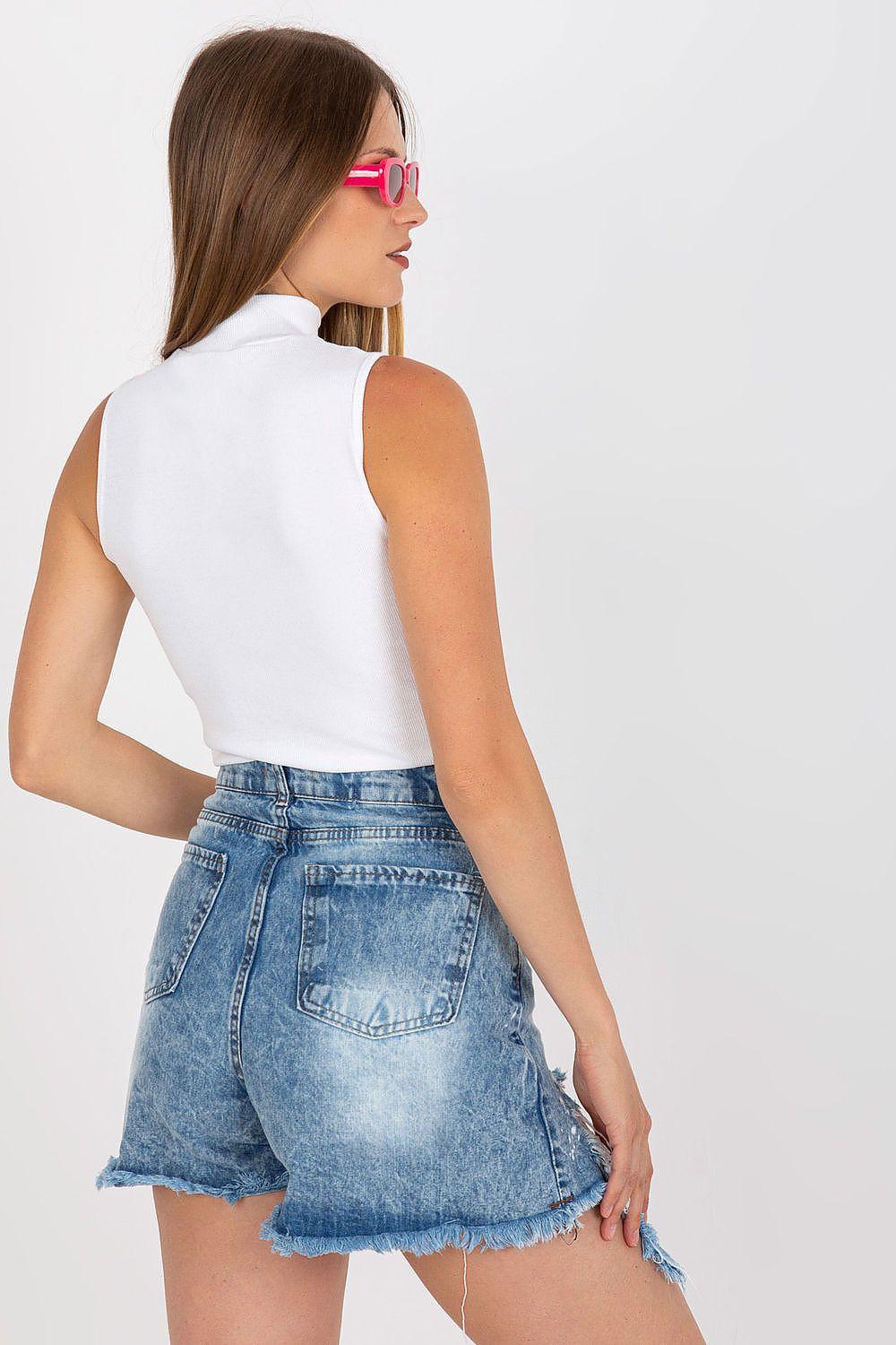 White sleeveless turtleneck top shown from back, fitted knit with high neck.