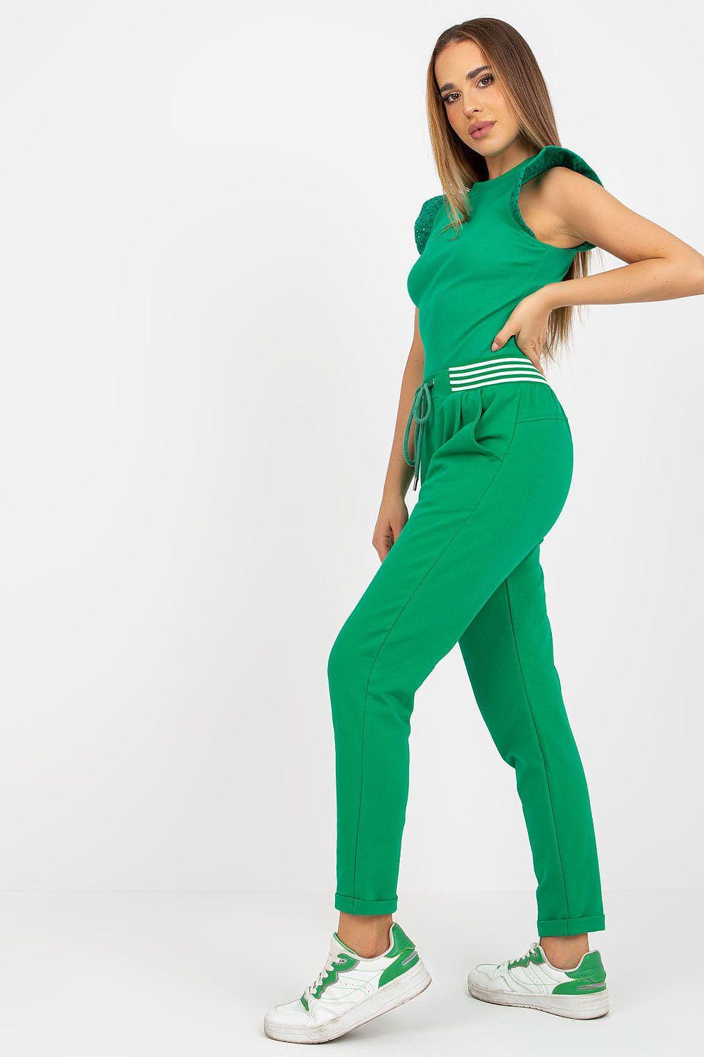 Green tracksuit trousers with drawstring waist and cuffed ankles, side pockets