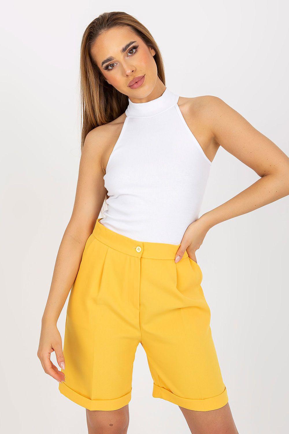 White ribbed sleeveless half-turtleneck top, fitted knit with high collar