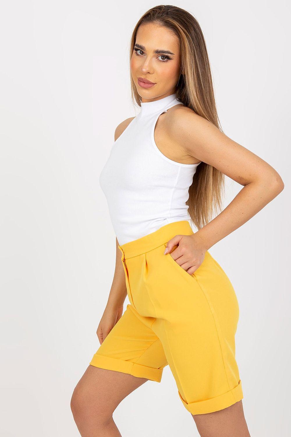 White sleeveless mock-neck top with asymmetric shoulder cut