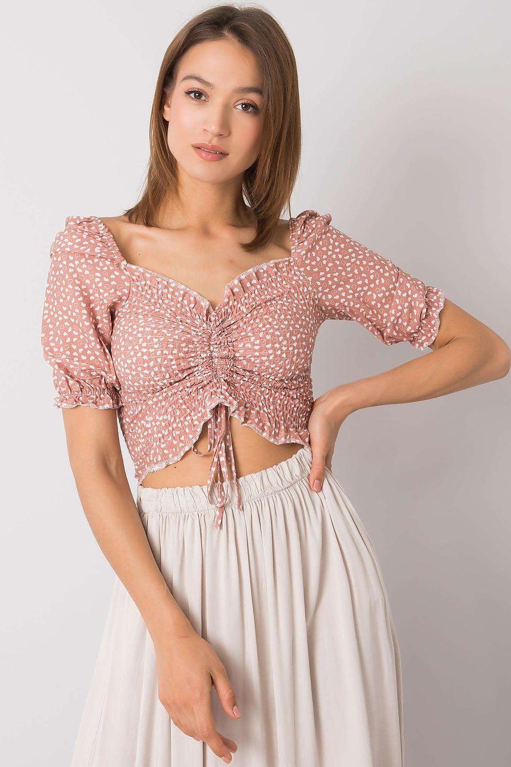 Pink fitted cropped blouse with V-neck and tie front, puff sleeves