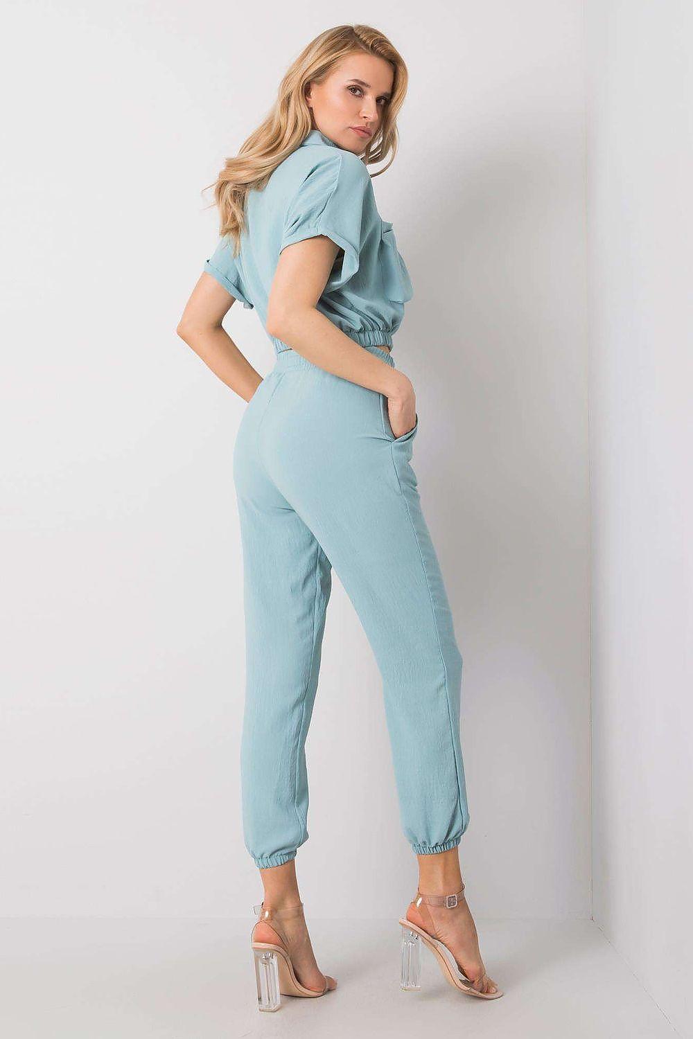 Women light blue trousers with elastic ankle cuffs, three-quarter angle