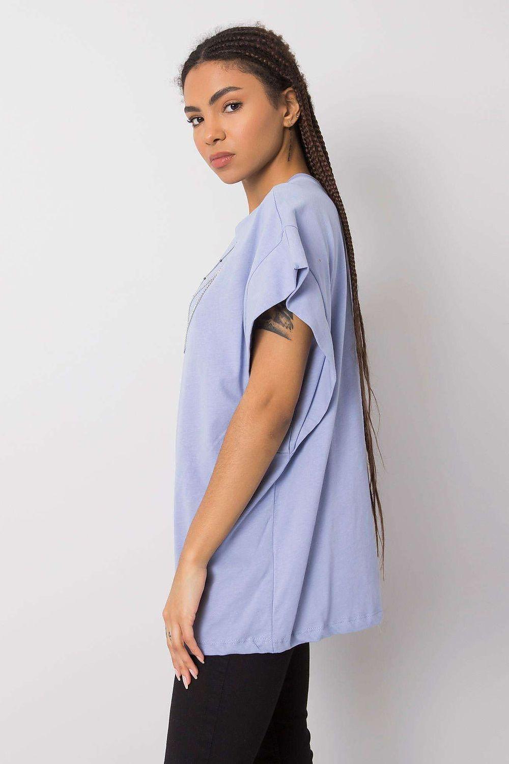 Light blue cotton blouse in side profile with flutter sleeves, round neck; chain necklaces