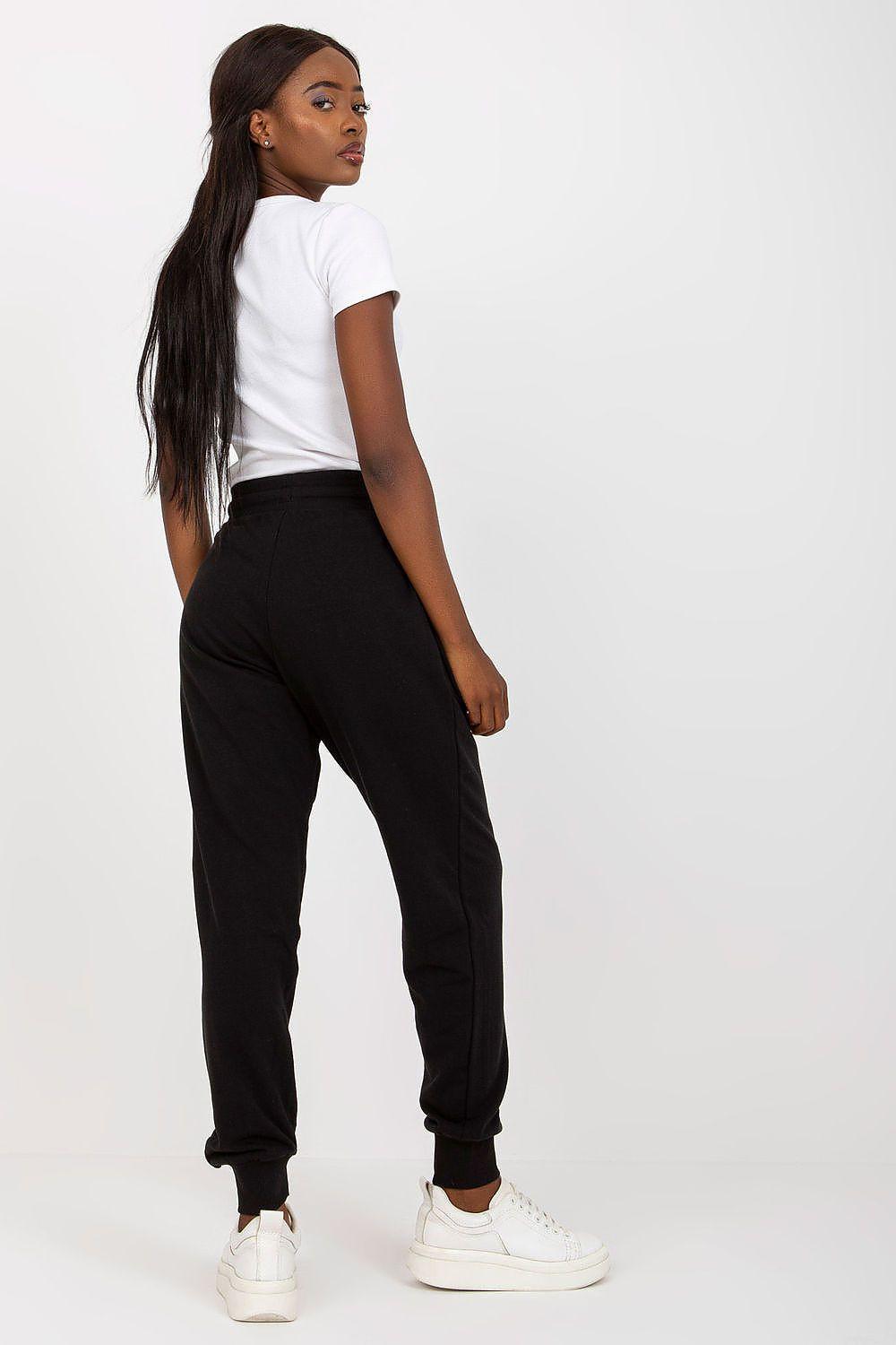 Black tracksuit jogger trousers with drawstring waist and gathered cuffed hem