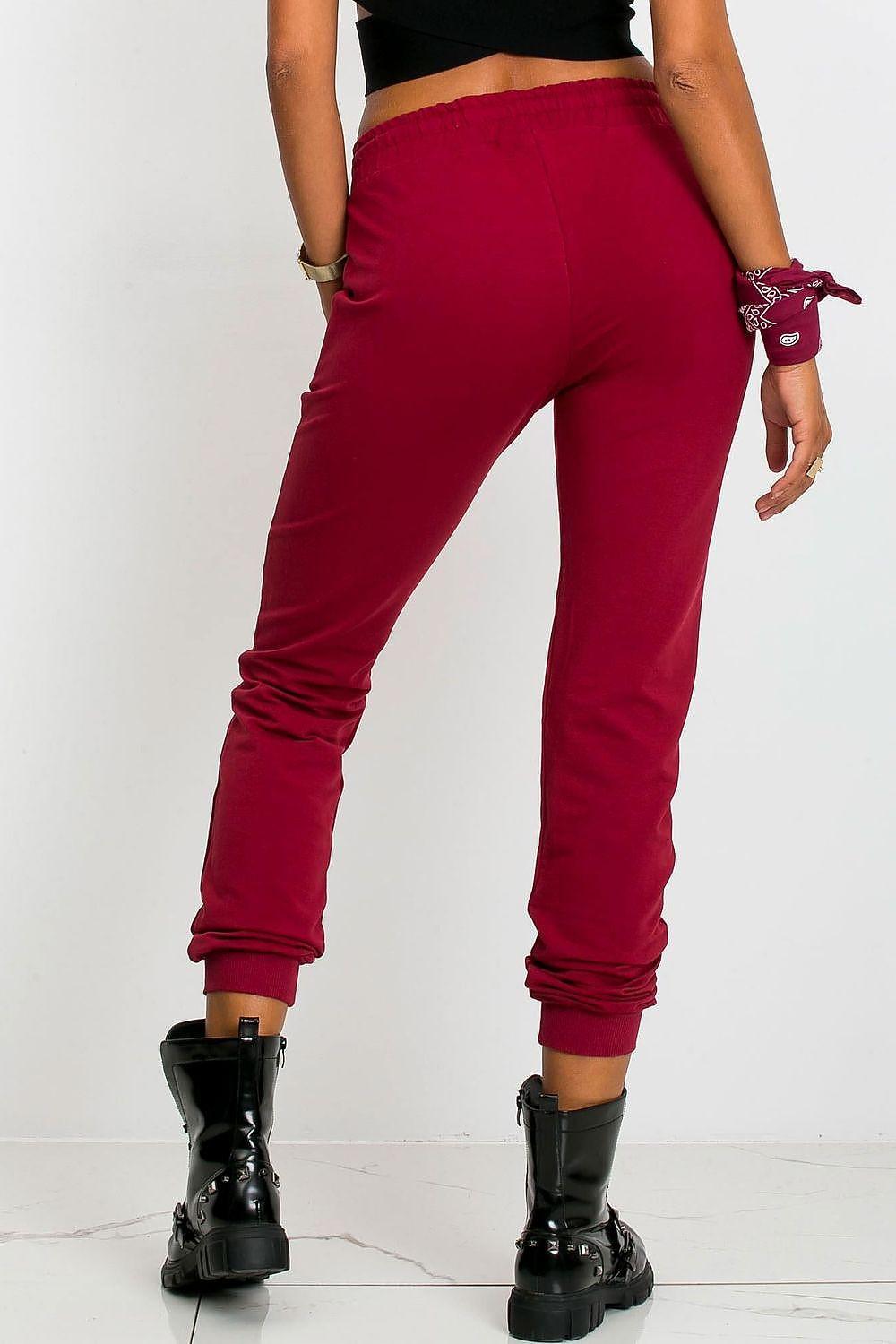 Red tracksuit trousers with drawstring waist and ankle cuffs in slim jogger fit