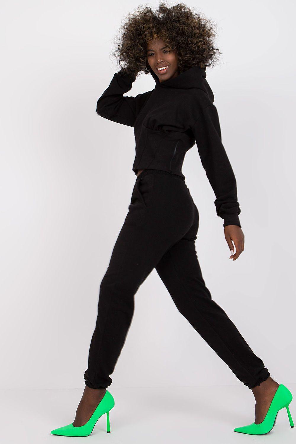 Black hoodie and jogger set with hood, cuffed sleeves and tapered pants