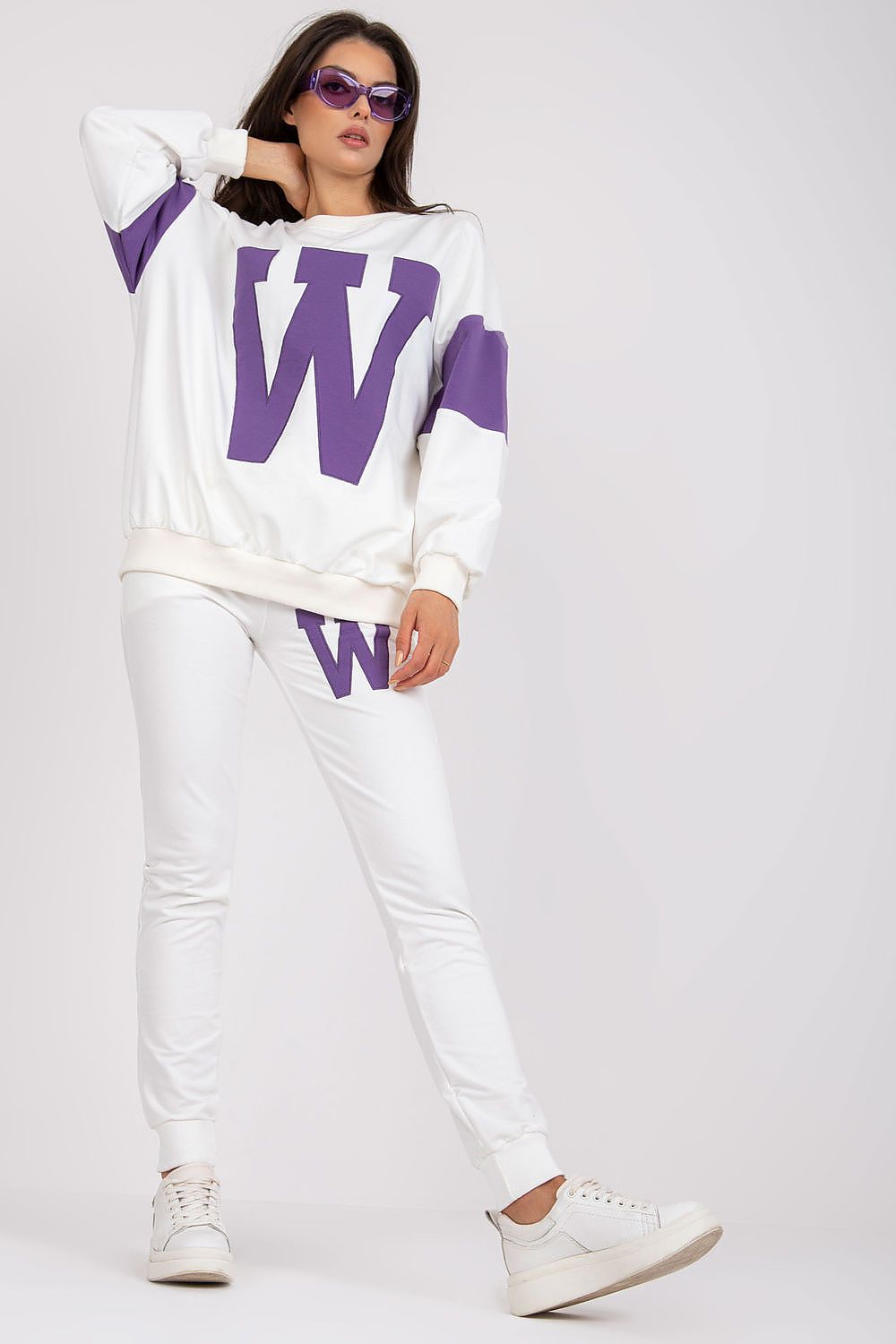 Women's white tracksuit set with violet W logo sweatshirt and jogger pants