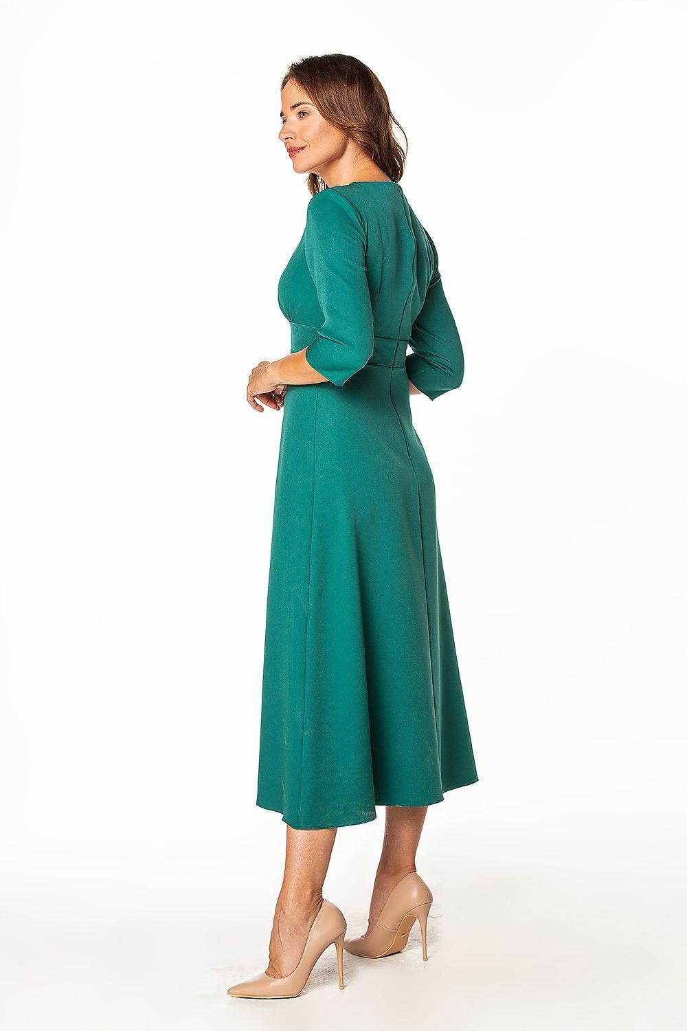 Green long-sleeve day dress from side view with V-neck and midi A-line skirt