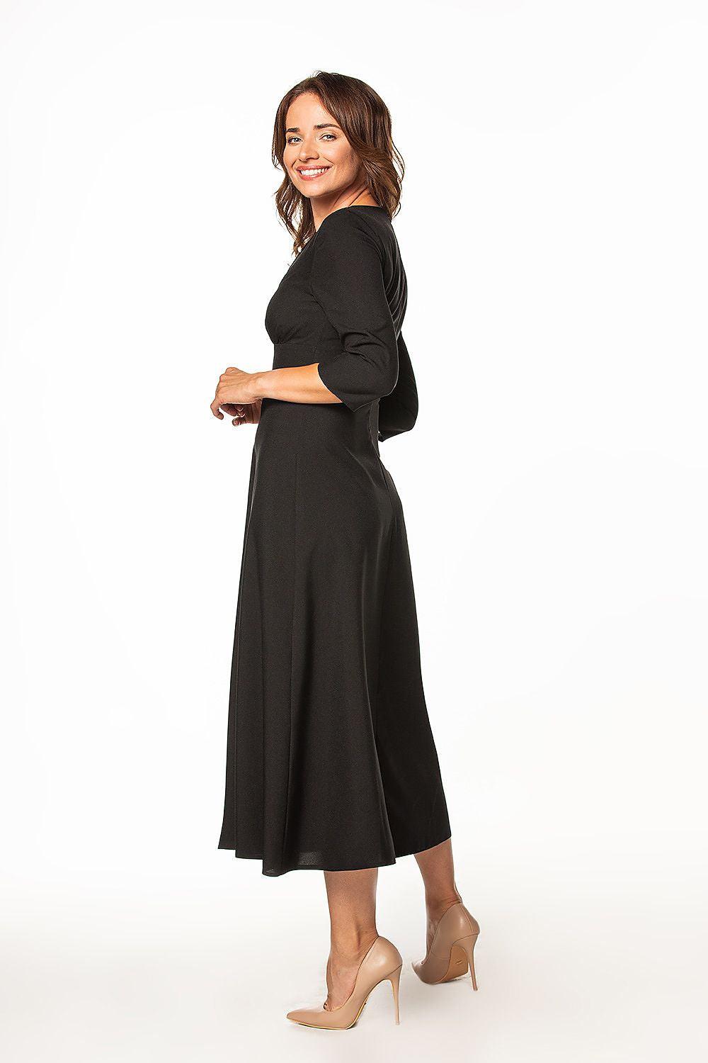 Black daydress, side view: V-neck, gathered waist, 3/4 sleeves, midi length