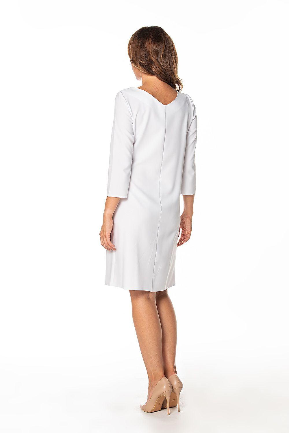 White daydress back view with 3/4 sleeves and tie waist belt, knee length
