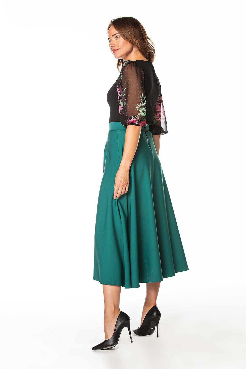 Green midi skirt with side slit and flared hem, visible side detail