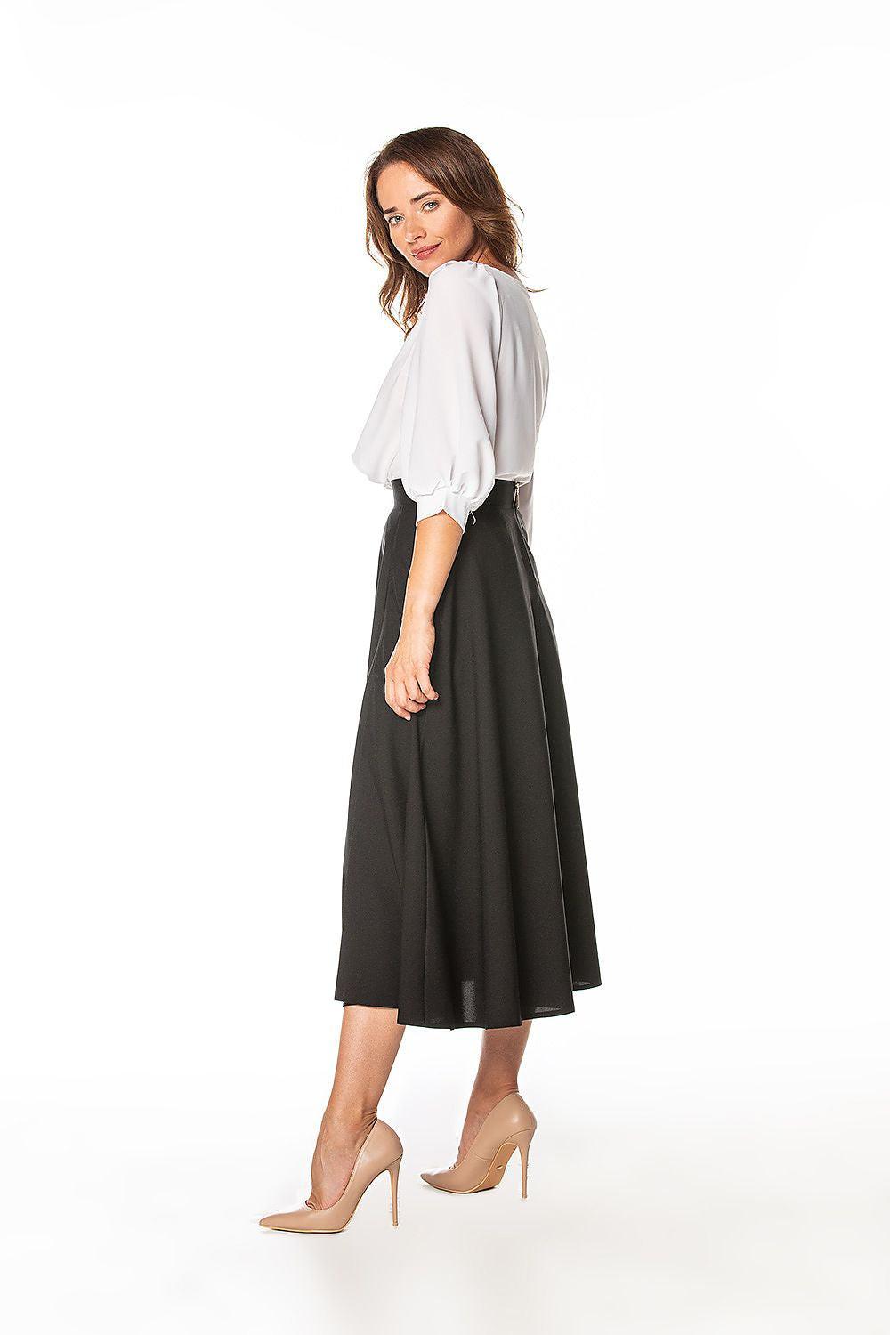 Black midi skirt with side slit and A-line silhouette