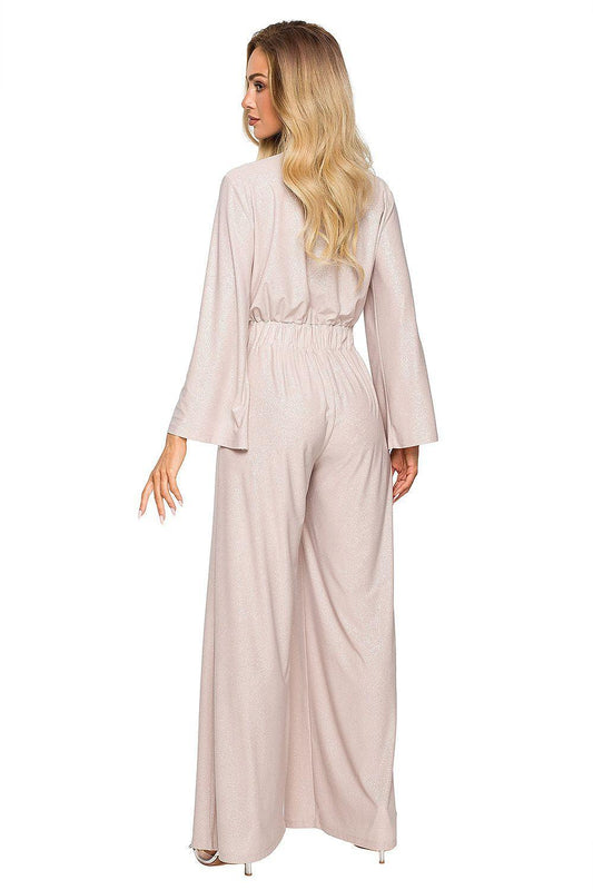 Beige long-sleeve jumpsuit back view with elastic waist and wide-leg pants