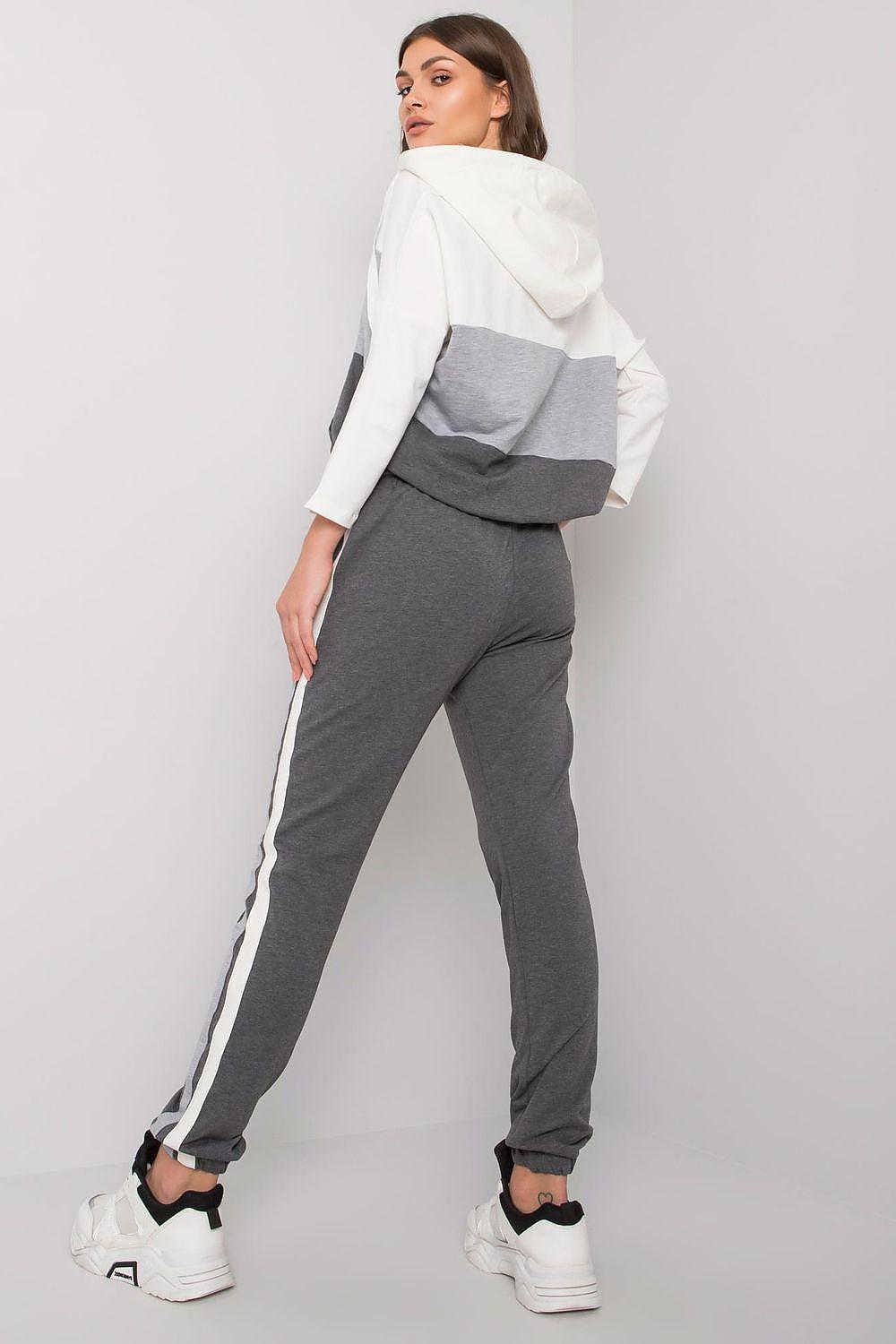 Women’s tracksuit set with grey joggers and white hooded sweatshirt with grey panel