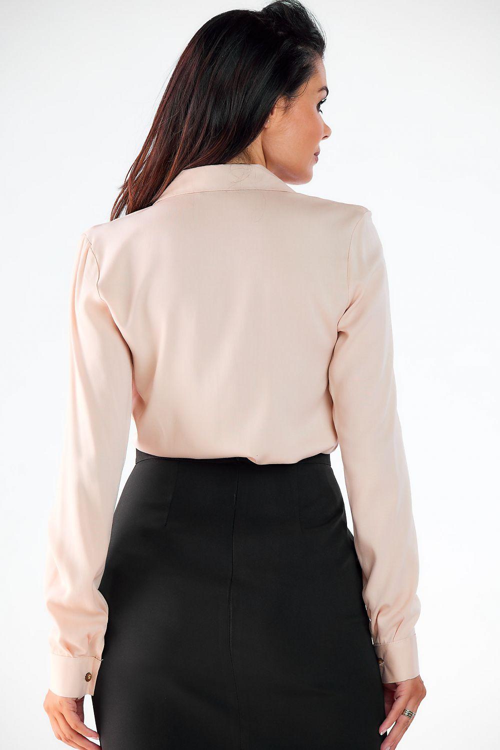 Beige long sleeve button-up shirt, back view with collar and button cuffs