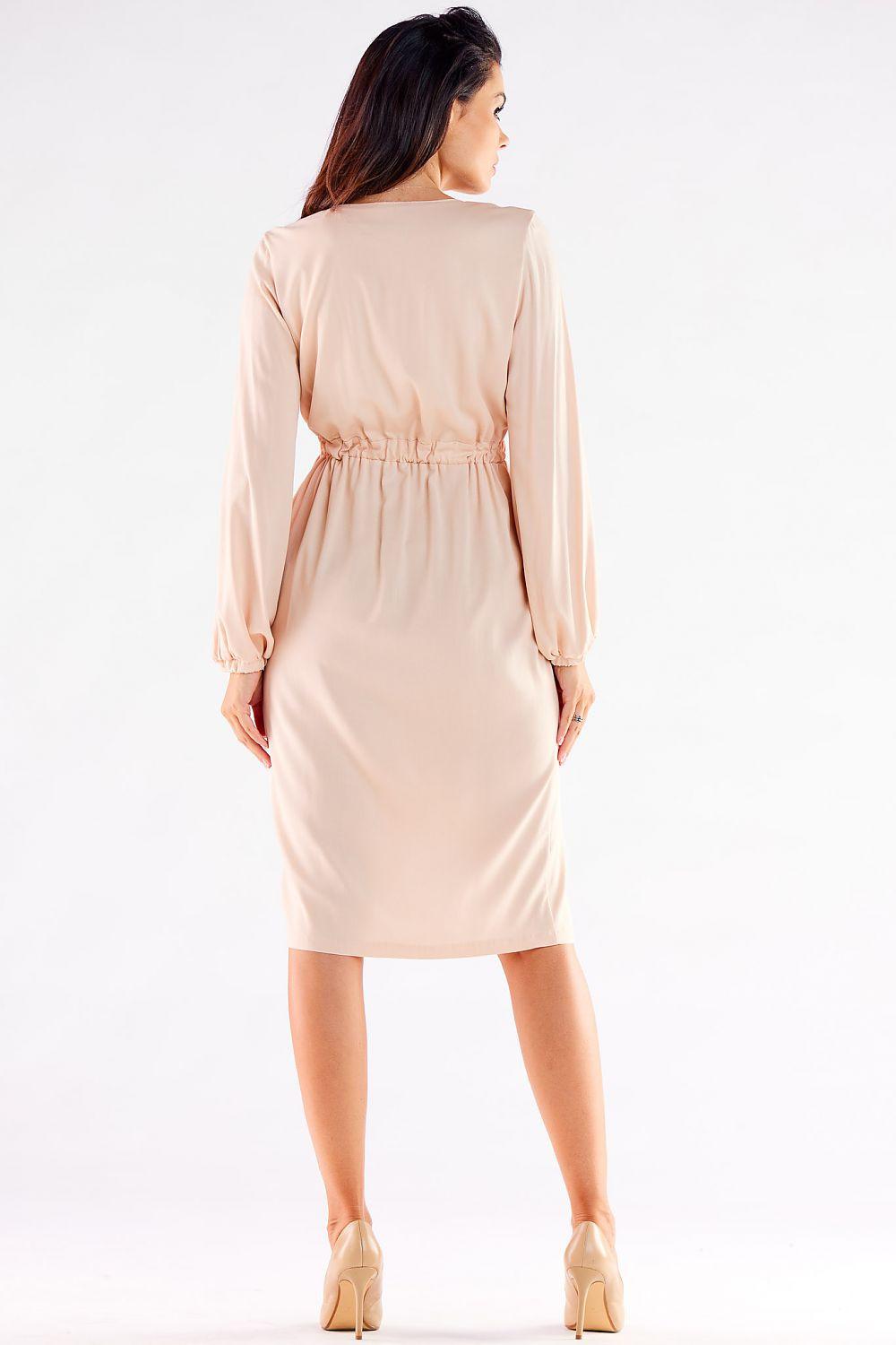 Beige V-neck cocktail dress with long sleeves and ruched waist, back view