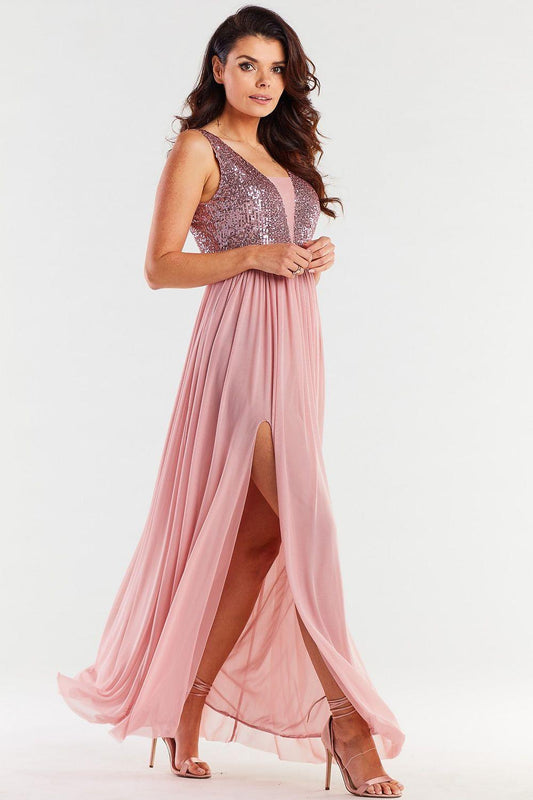 Pink long dress with silver sequin bodice and sleeveless styling, side slit
