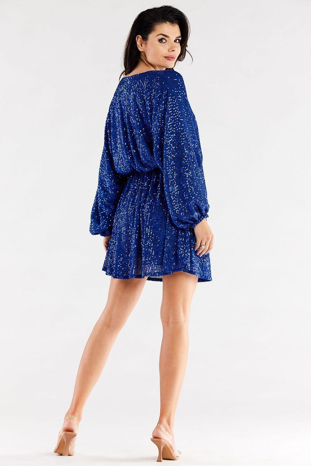 Blue sequin evening dress with long sleeves and short A-line skirt, belted waist.