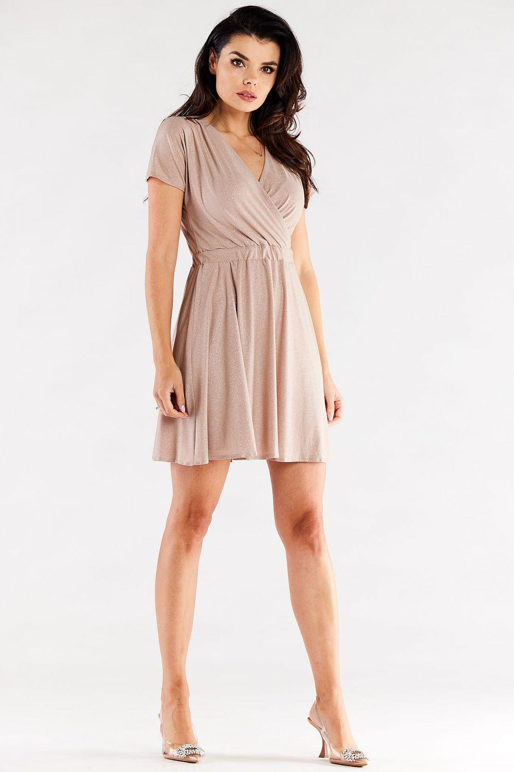 Beige wrap-style evening dress with V neckline, short sleeves, gathered waist and flared skirt