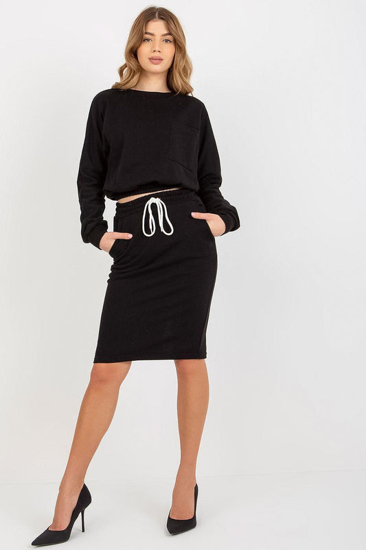 Black two-piece set with long-sleeve top and fitted midi skirt, white drawstring tie