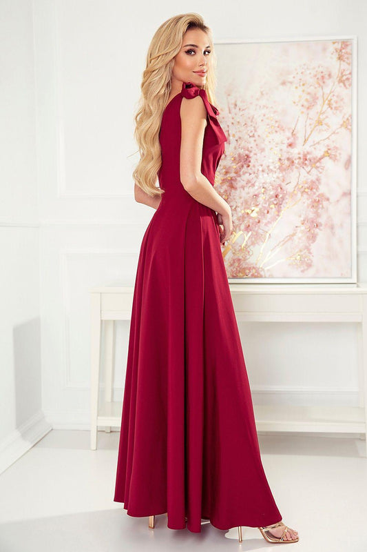 Red long sleeveless V-neck dress with bow-like shoulder detail and flowing skirt
