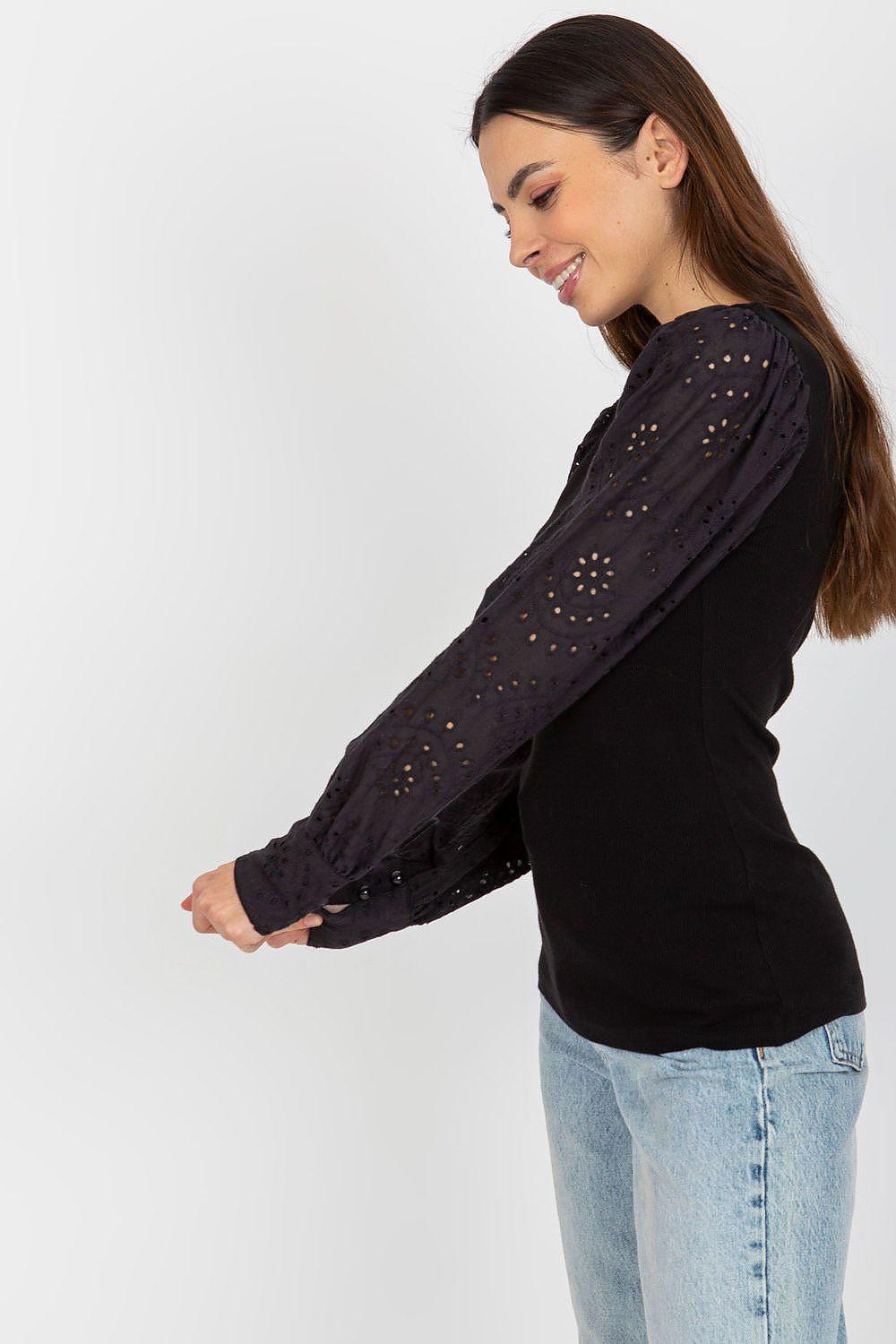 Black long-sleeve blouse with puff sleeves and sequin speckle, crew neck