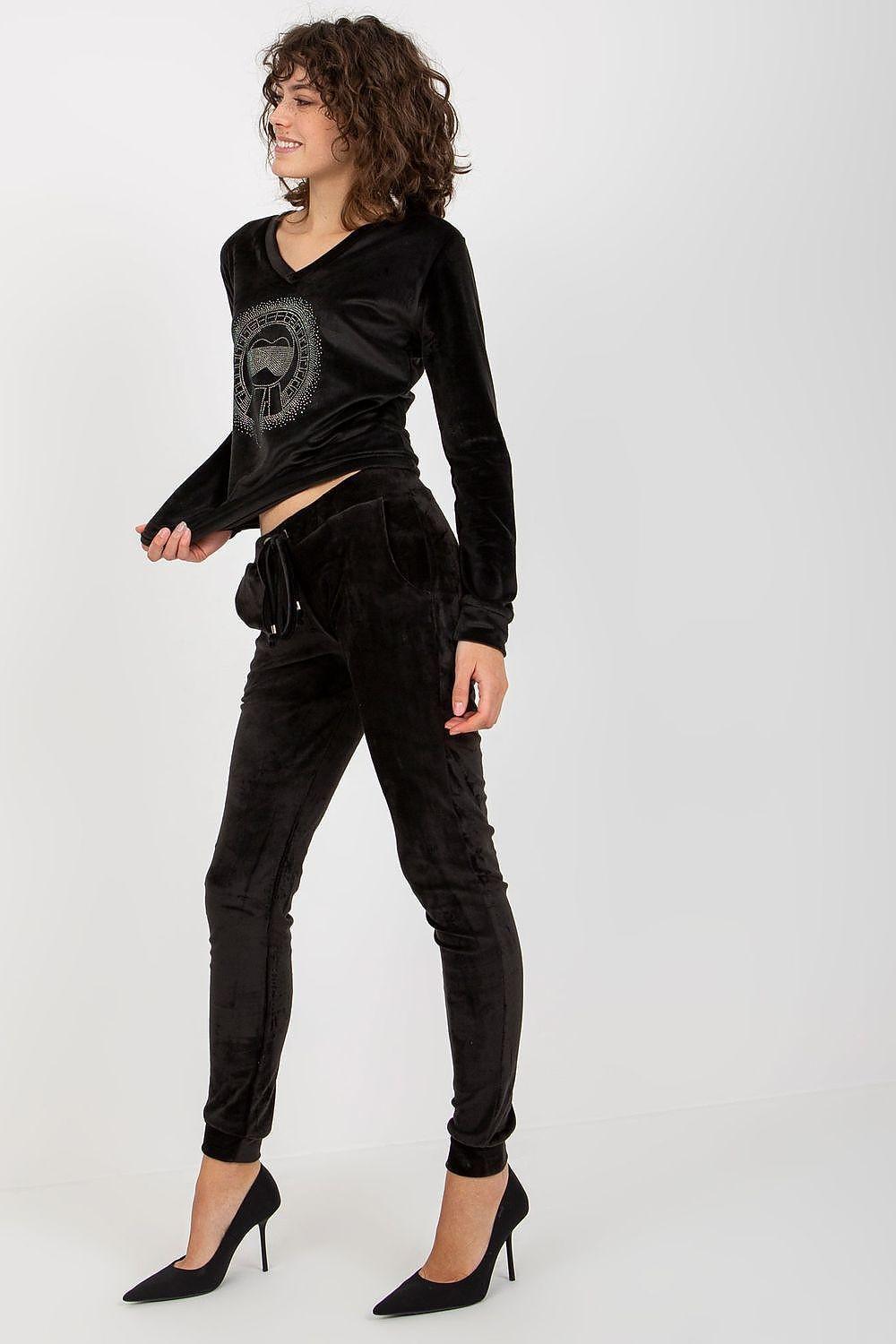 Black velour tracksuit set with logo V-neck top and slim jogger pants, side view