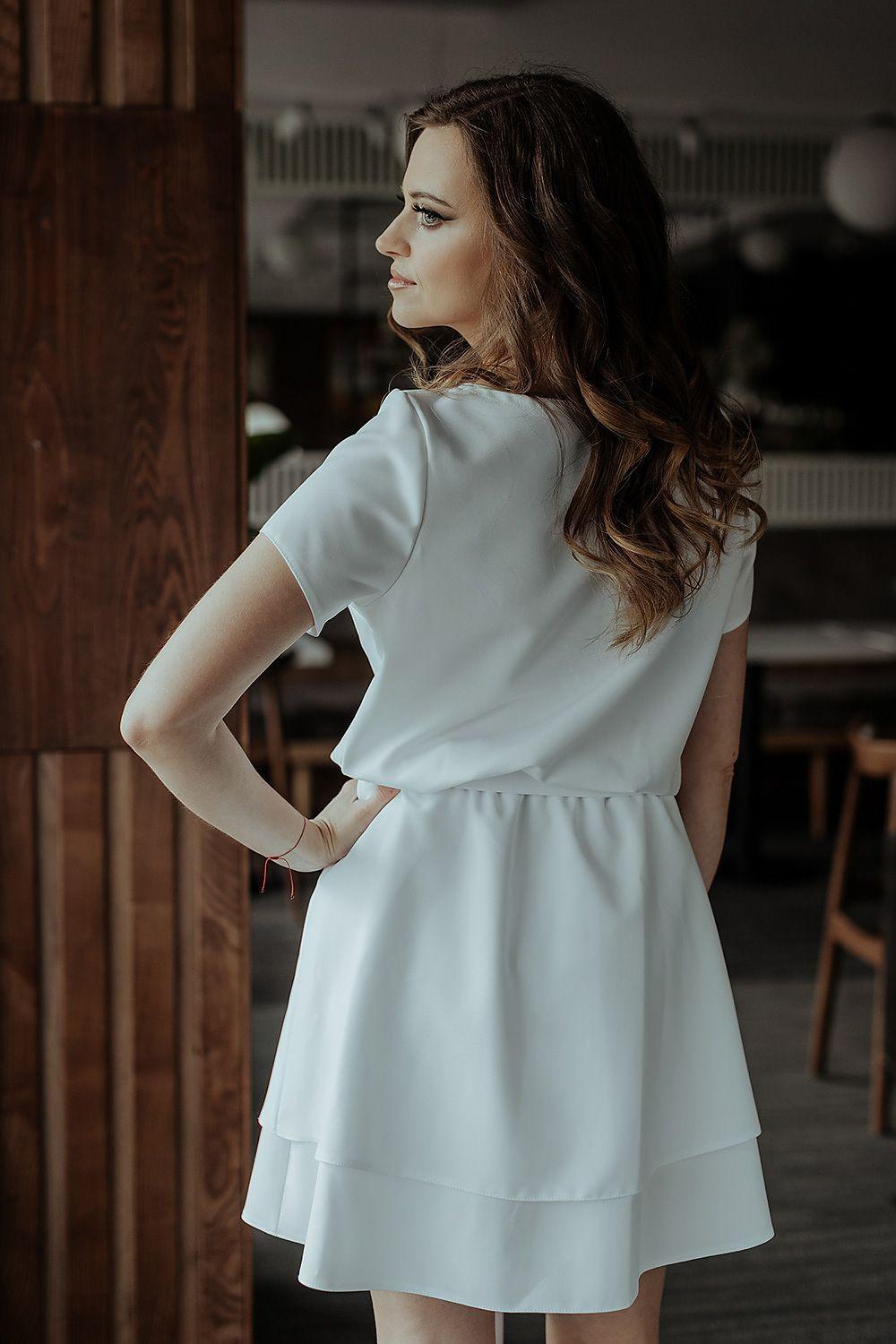 Tessita daydress in white, short sleeves, tiered skirt, waist bow detail, back view