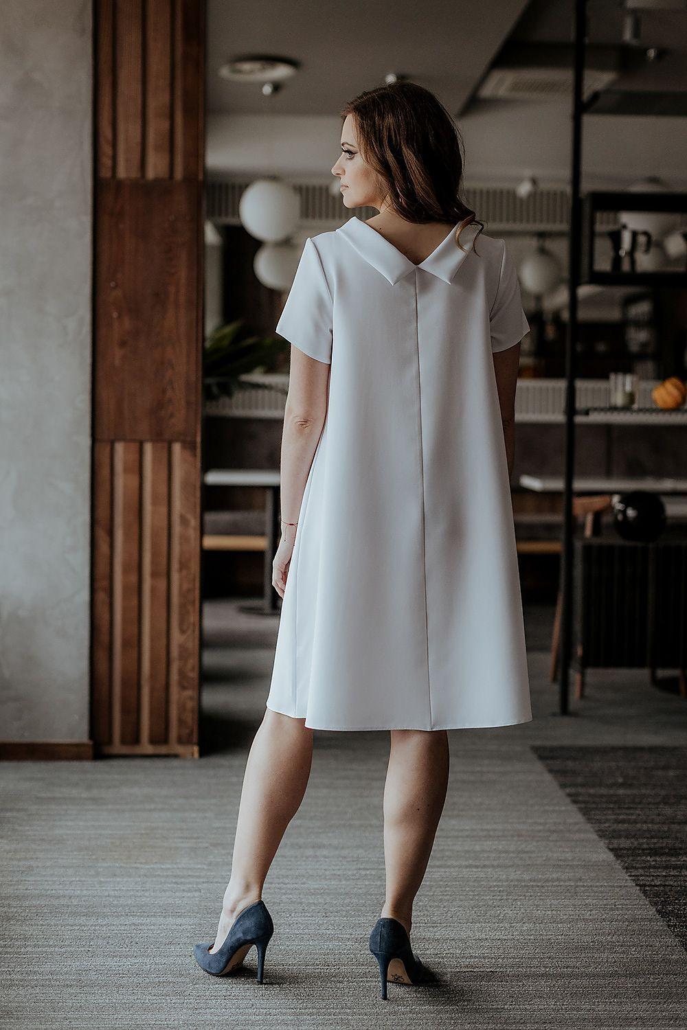 White short-sleeve A-line dress with V-neck back and knee-length hem