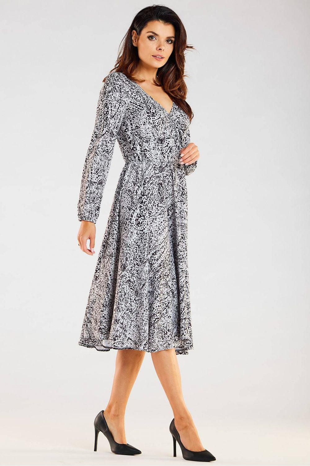 V-neck long-sleeve daydress in white with black print, fit-and-flare midi silhouette