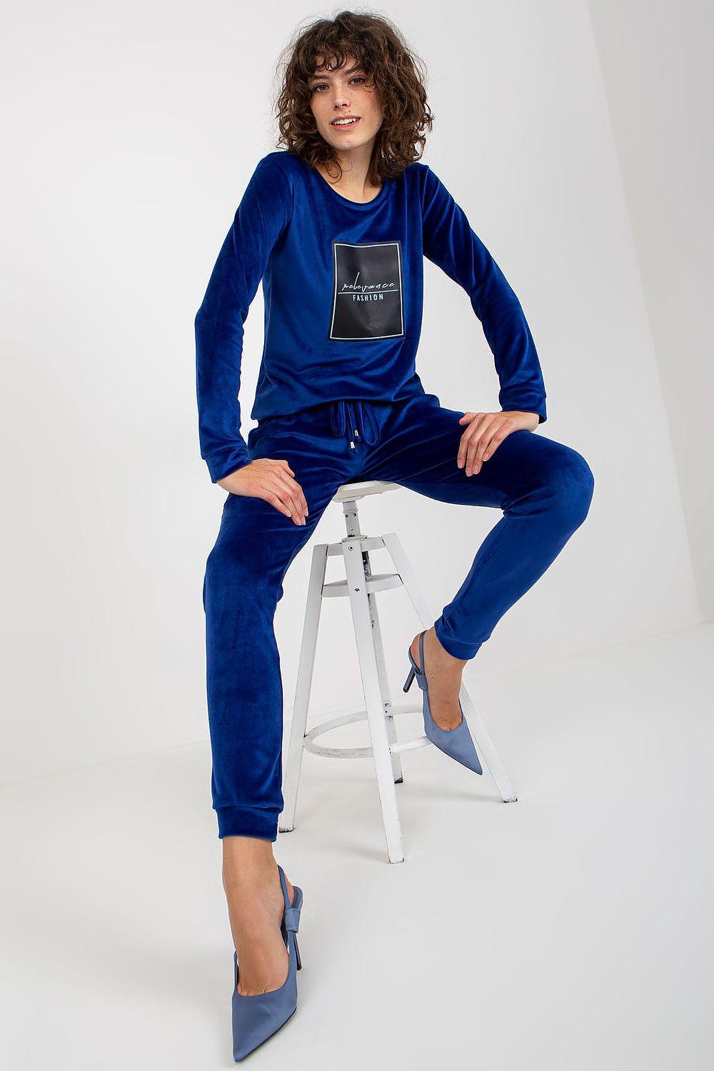 Blue velour tracksuit set with crewneck sweatshirt and tapered jogger pants
