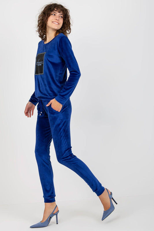 Blue velour tracksuit set with long sleeves and jogger pants, side view