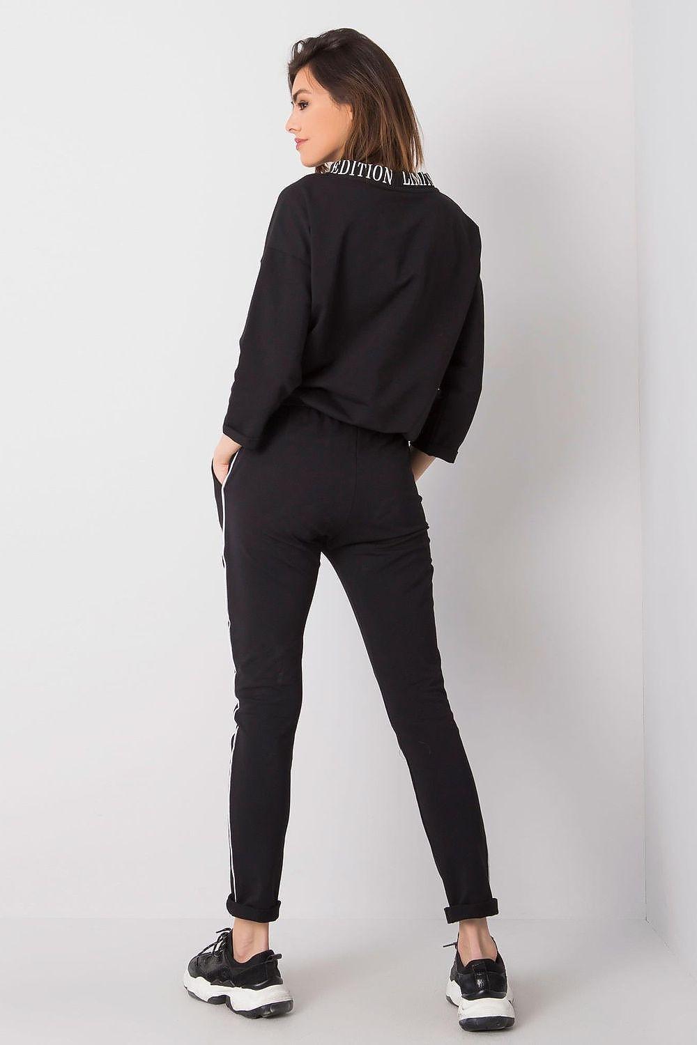 Black back-view hoodie and jogger set with tapered legs and side pocket detailing
