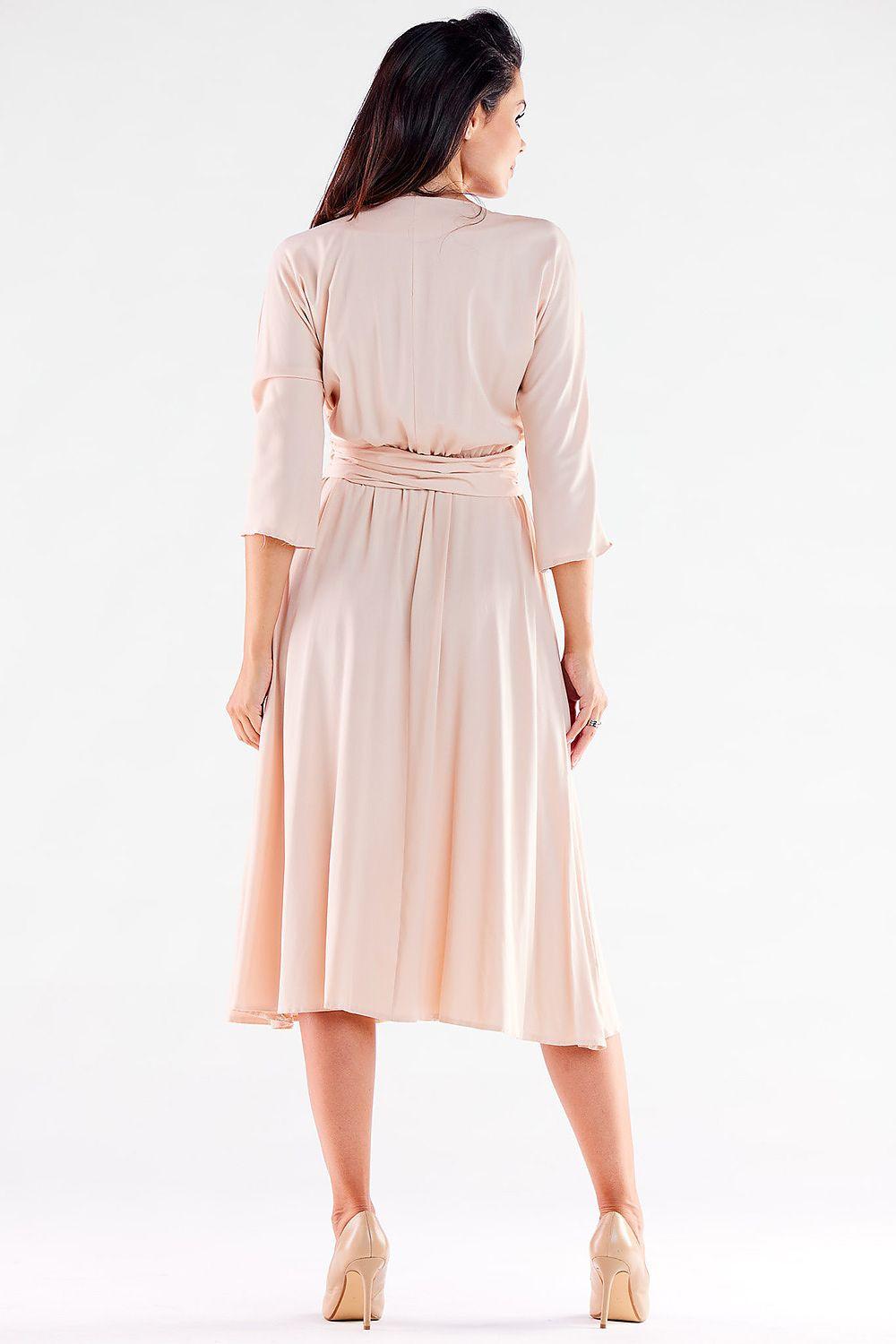 Beige daydress, back view, with tied waist belt and 3/4 sleeves