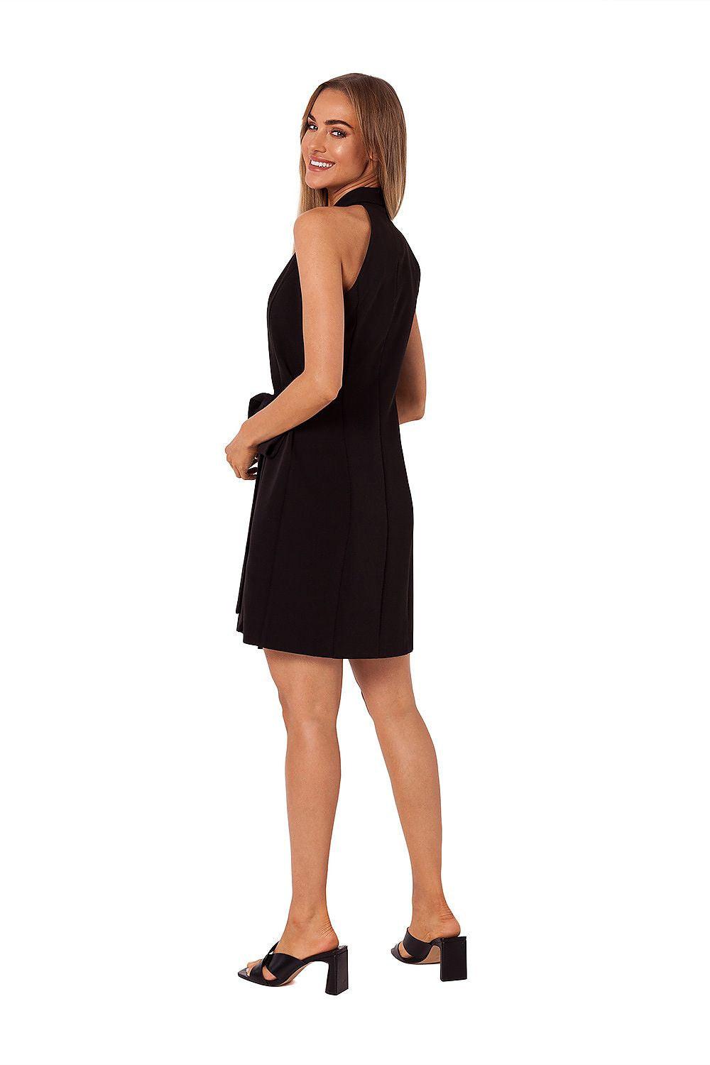 Black sleeveless daydress with tied waist and open-back V detail, above-knee length