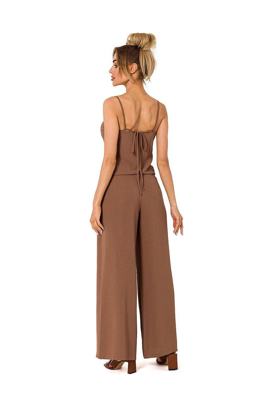 Back view of sleeveless wide-leg jumpsuit in brown with tie at waist