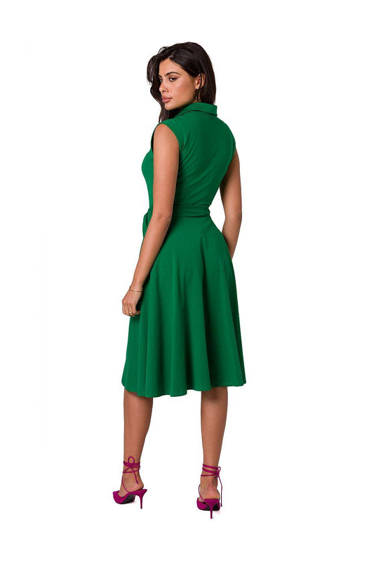 Green sleeveless day dress from back, high neckline, fitted waist and pleated skirt, knee length.
