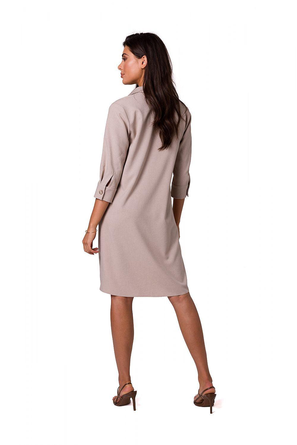 Light beige daydress back view with 3/4 sleeves and curved hem