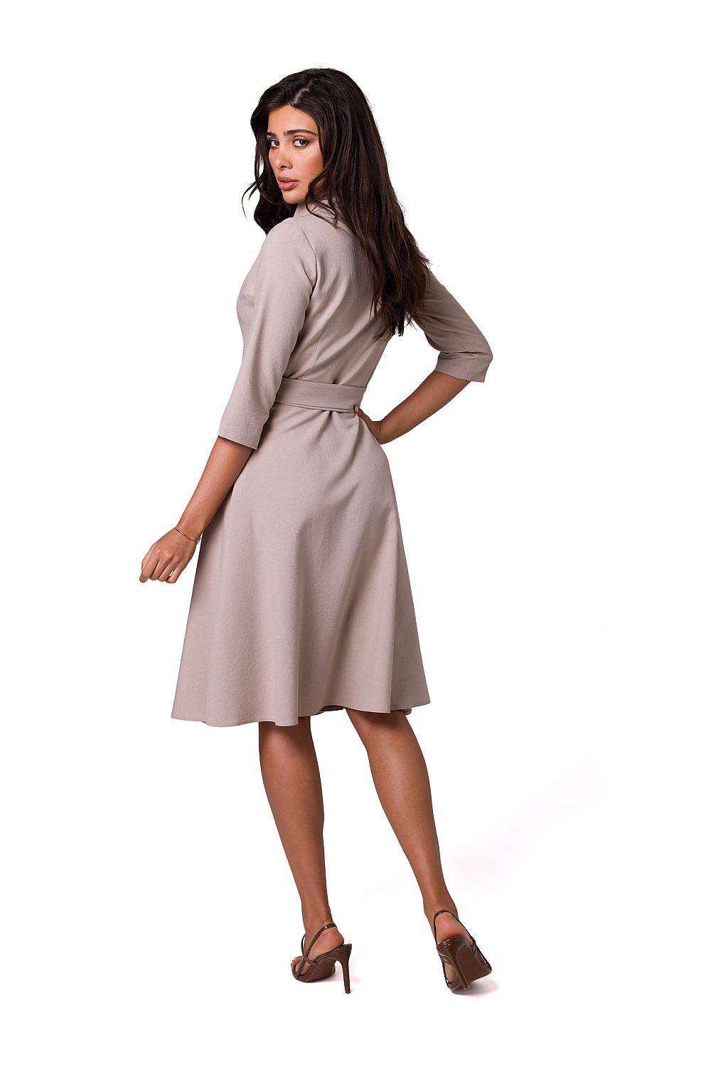 Beige wrap daydress with V-neck and waist tie belt, midi length, side view