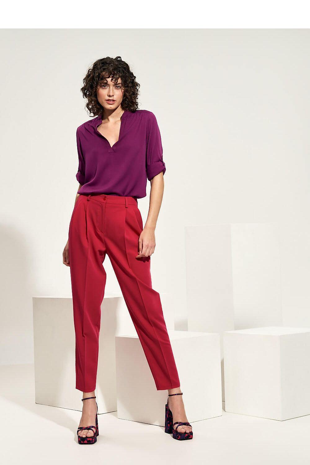 Women's magenta trousers, side view, ankle-length tapered leg