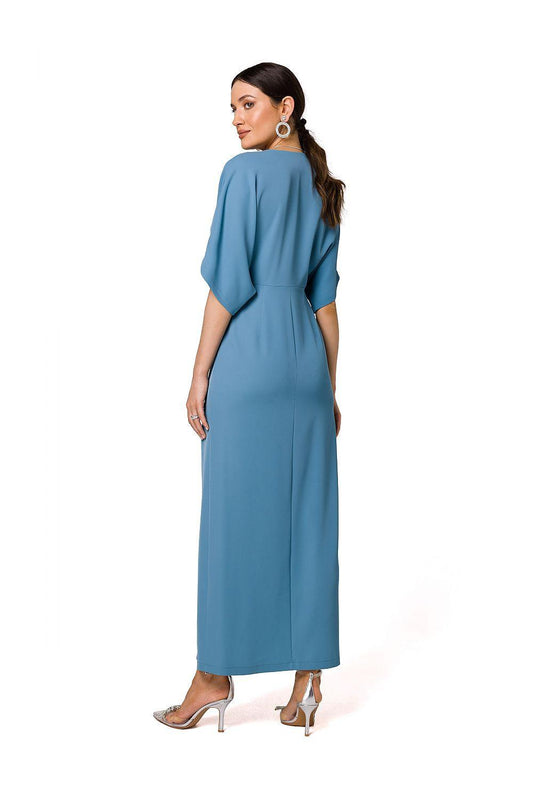 Blue evening dress back view with V-neck, dolman sleeves, side slit, midi length.