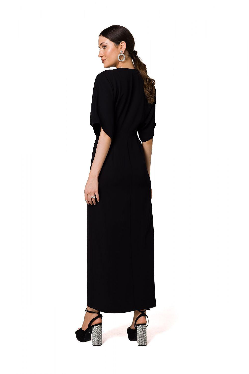 Black evening dress with V-back, kimono sleeves, and high side slit at the hem