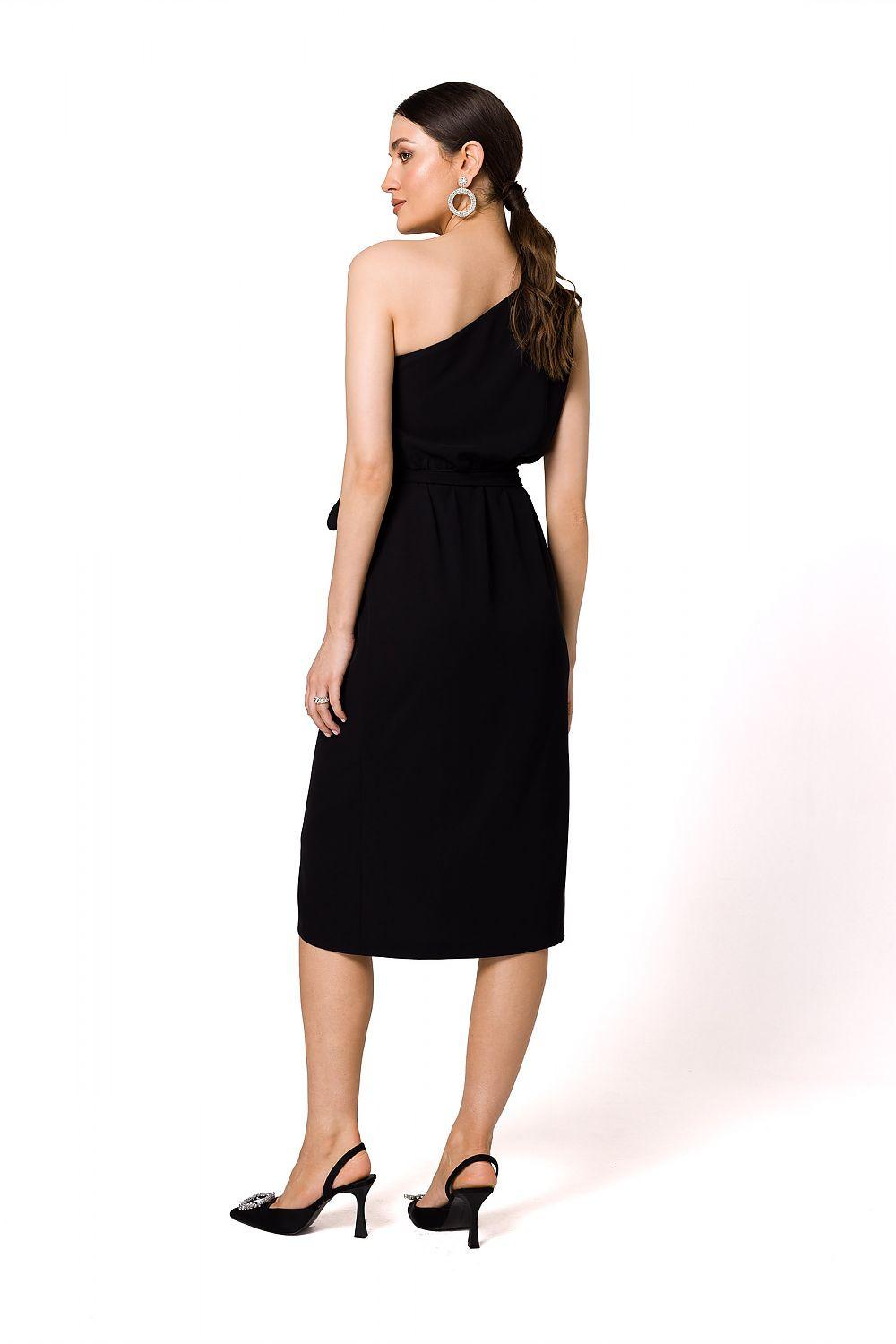 One-shoulder cocktail dress in black with draped overlap skirt, side/back view.