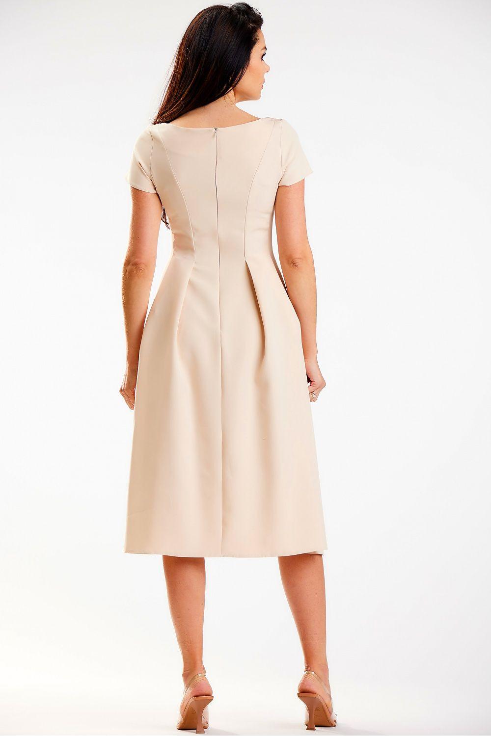 Beige daydress with short sleeves, back zipper, A-line skirt, rear view.