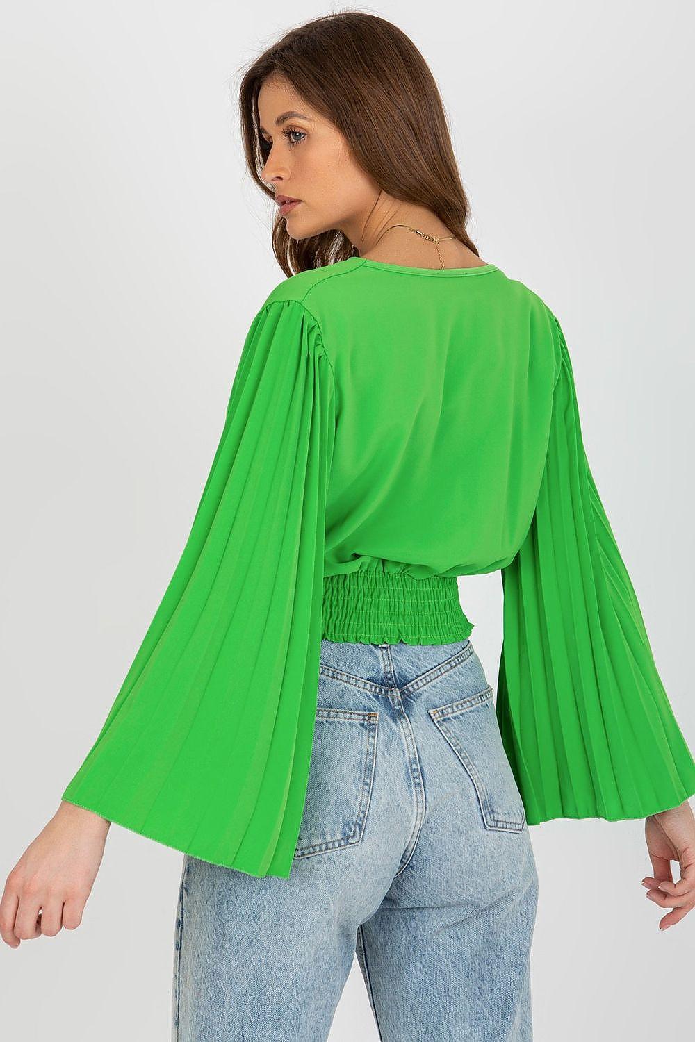 Green blouse with V-neck, long pleated bell sleeves, smocked waist, back view.