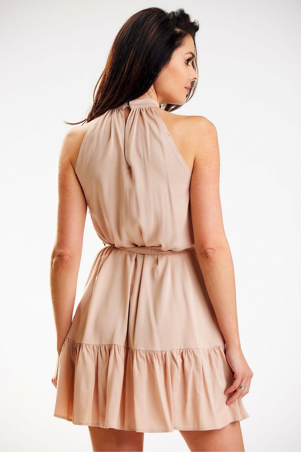 Light beige halter daydress with gathered waist and ruffled hem, back view
