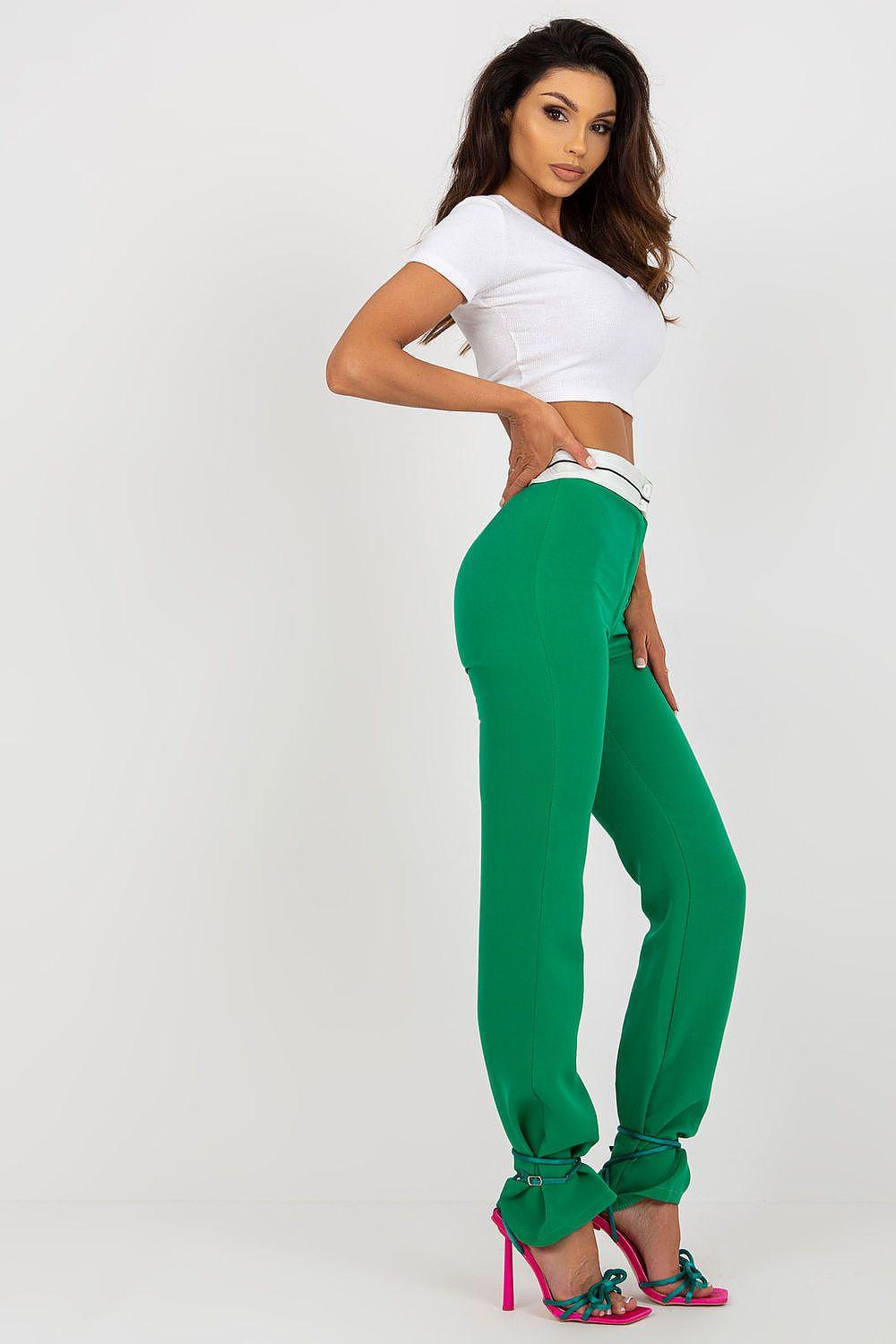 Green high-waisted wide-leg trousers, angled side view with ankle cuff detail